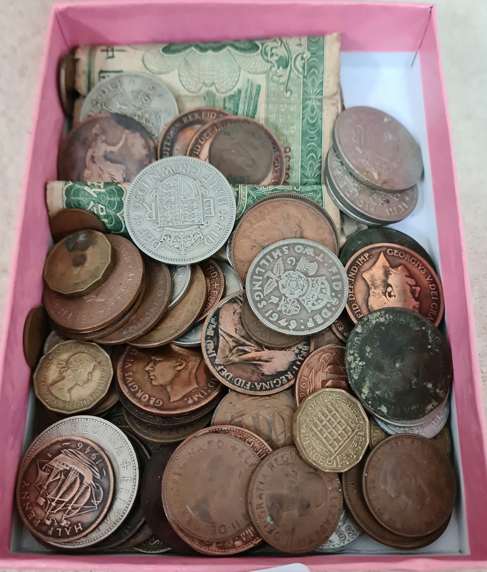 A collection of coins and banknotes to include pre WW2.