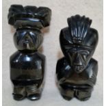A pair of South American cut glass figures with chatoyancy effect.