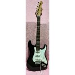 An Aria STG series black strat copy electric guitar with soft case