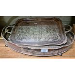 Two silver plated trays, one with pierced gallery and bun feet, the other having twin hadles and
