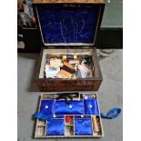 A Victorian inlaid walnut sewing box with contents.