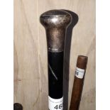 A hallmarked silver topped ebonised walking stick.
