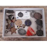 A selection of mainly military badges, pins, medals, etc to include silver, two A.R.P silver pins, a