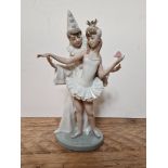 A Lladro figure "Parejita Carnaval", no. 4882, height 26cm, with box. Condition - finger to girl