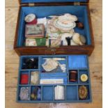 A Victorian rosewood sewing box with mother of pearl inlay and key, containing haberdashery items
