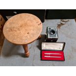 A mixed lot comprising a milking stool, a Parker pen and pencil set and a box camera.