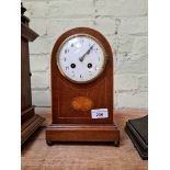 An Edwardian inlaid domed top mantle clock, French movement striking on single coil.