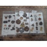 A collection of military and miscellaneous badges and pins to include enamelled, gilt, etc.