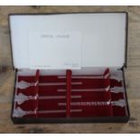 A boxed set of Lalique drinks stirrers.