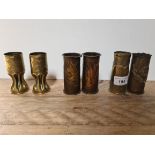 3 pairs of shell cases made into vases, a pair with raised leaf, rims turned over, base of one is