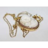 A hallmarked 9ct gold mounted shell cameo pendant on chain marked '9k', gross wt. 6.1g.
