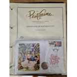 A folder containing The Pantomime collection of 50 pence pieces, 5 in total.