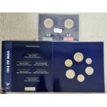 A 2017 Isle of Man coin collectors pack and two Isle of Man £2 coins.