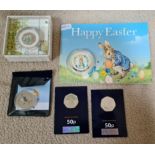 A Peter Rabbit 2020 UK 50p silver proof coin, two Peter Rabbit 50p pieces, a Peter Rabbit