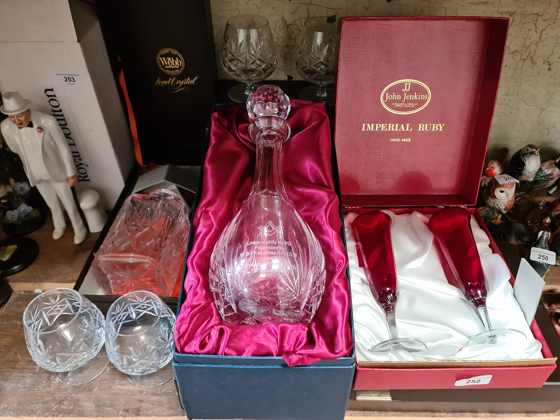 A Webb hand cut lead crystal decanter, a crystal decanter presented to Ken Jones to mark 50 years in