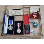 A collection of medals and collectables including a Lads Church Brigade 1919 medal, two