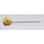 A rosette stick pin marked '9ct', wt. 1.4g, length 61mm.