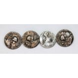 A matched set of four Edwardian Aat Nouveau silver buttons, three hallmarked for Robert Pringle &