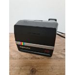 A vintage Polaroid Supercolor 635 camera with case.