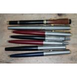 A collection of pens to include Parker and with iridium nib.