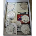 A collection of eight commemorative coins in capsules to include a Guernsey 1995 silver proof £1,