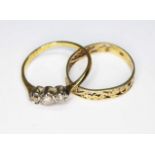 Two rings, one diamond ring marked '18ct' and a pierced ring marked '585', gross wt. 3.4g, size N.