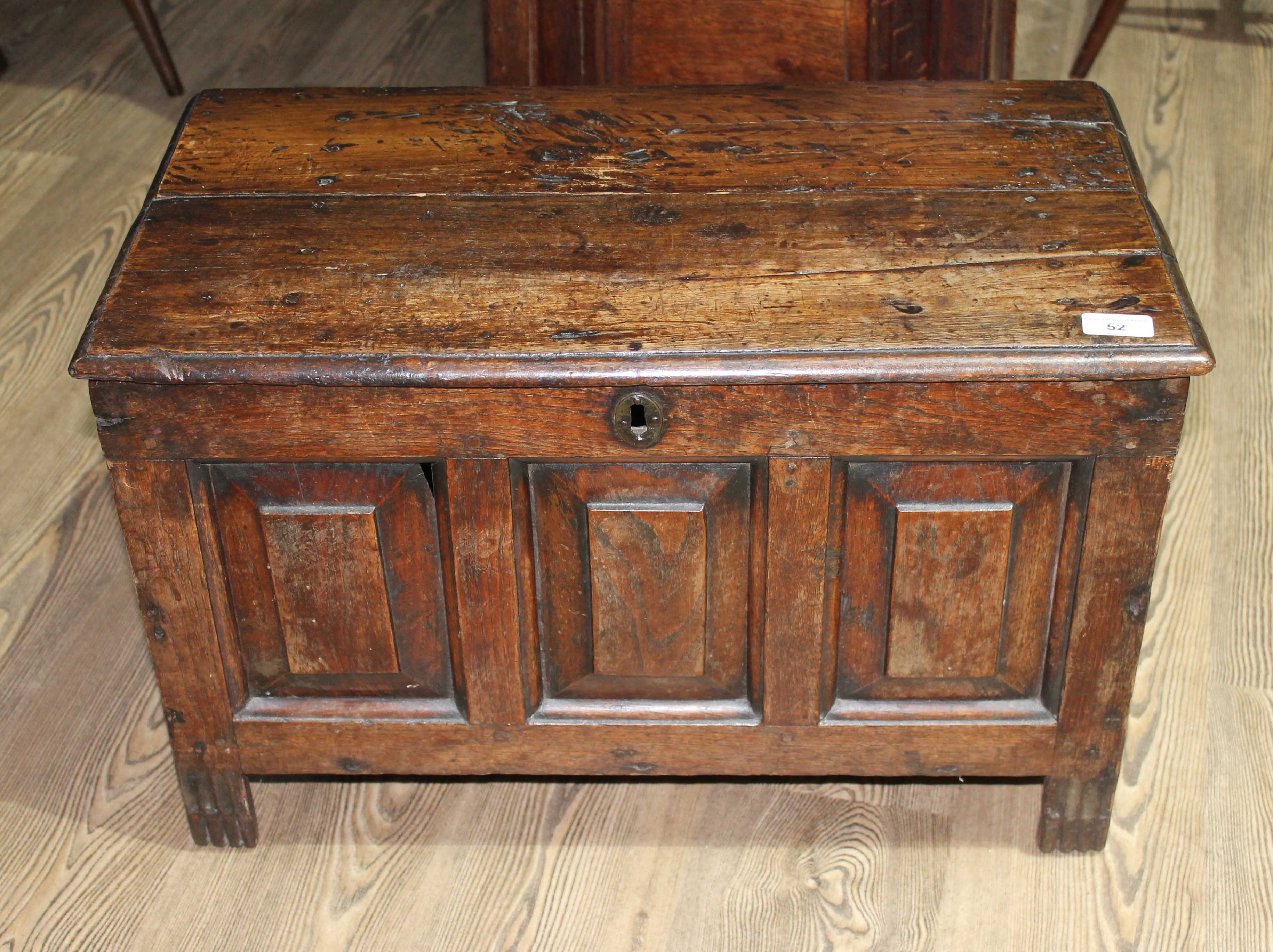 An 18th century panelled oak coffer of miniature proportions, possibly for a child, length 63cm,
