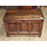 An 18th century panelled oak coffer of miniature proportions, possibly for a child, length 63cm,