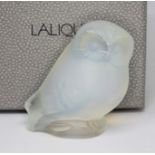 A Lalique opalescent owl paperweight, etched marks to base, height 5.5cm, with box.