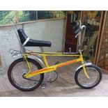 A 1977 yellow Raleigh Chopper MKII vintage bicycle. Condition - the frame appears to have been re-