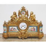 A French late 19th century gilt bronze mantel clock with Sevres style porcelain panels, the movement