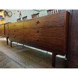 A mid 20th century teak sideboard with leather handles by Beithcraft, length 181cm.