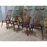 Four Ercol dark beech and elm 'Goldsmith' dining chairs including two carvers.