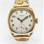 A 1940s 9ct gold cased Hirco wristwatch, champagne dial with outer minute track, Arabic numerals,