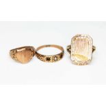 A group of three child's rings, one marked '9.375', another indistinctly marked '22' and one