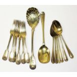 Assorted silver gilt cutlery comprising a set of six forks and a large spoon with shell bowl by