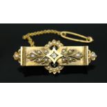 A Victorian Estruscan revival diamond and split pearl brooch, length 47mm, gross wt. 7.2g.