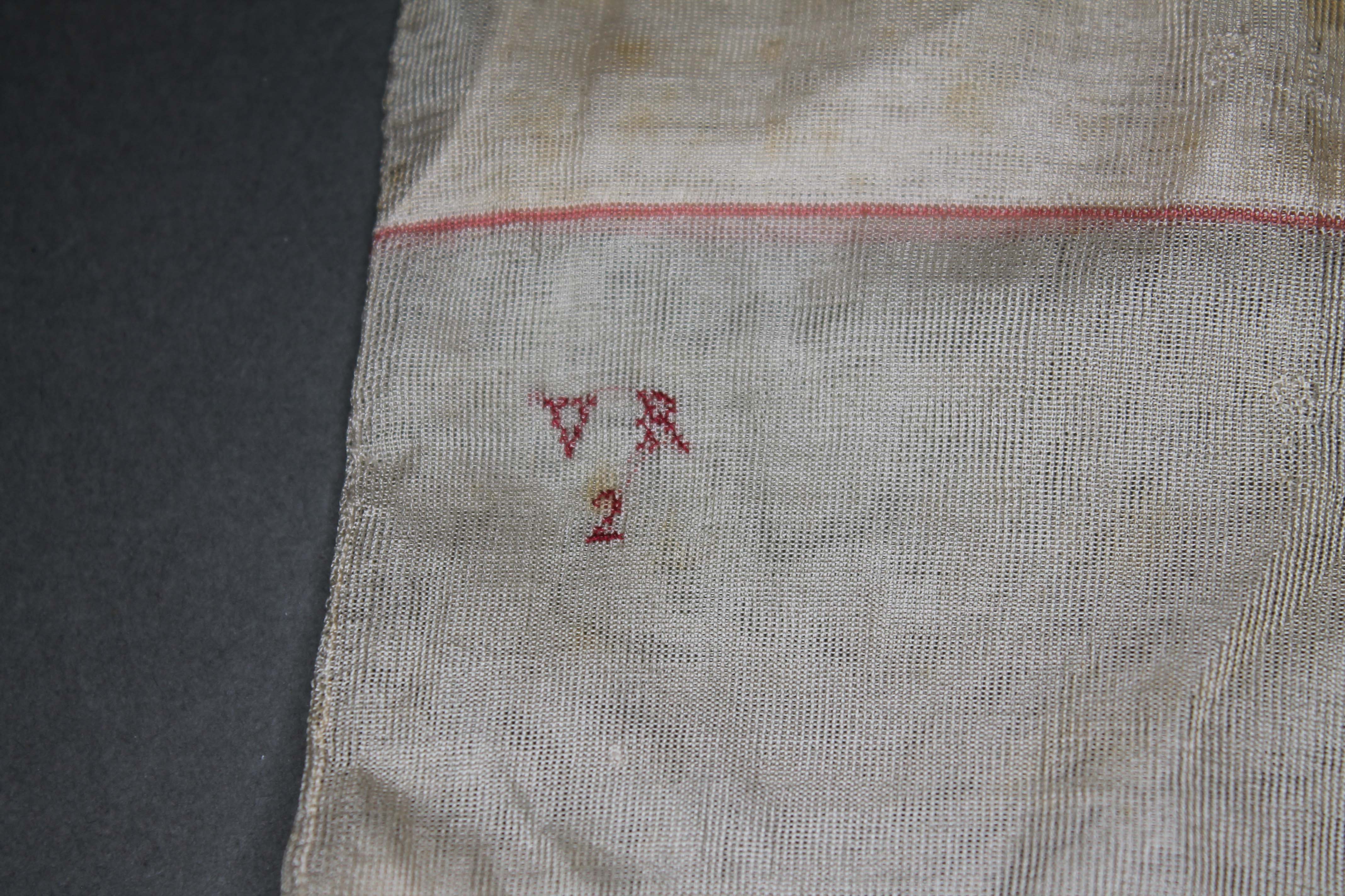 A pair of Silk stockings reputedly once belonging to Queen Victoria, monogrammed 'VR2' above a - Bild 2 aus 2