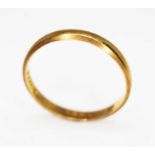 A hallmarked 22ct gold wedding band, wt. 2.4g, size P. Condition - general wear.