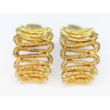 A pair of earrings half hoop design formed from folded textured wire, marked '18K', length 20mm,