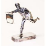 An Elkington & Co silver and silver plated figure depicting a news paper boy, height 15cm.