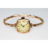 A ladies hallmarked 9ct gold Trojan wristwatch with flexi strap marked '9ct', gross wt. 13.7g.