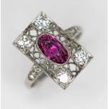 An antique Art Deco period ruby and diamond cluster ring, the millegrain set oval cut purplish