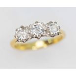 A three stone diamond ring, the round brilliant cut diamonds weighing approx. 0.38, 0.44 & 0.41