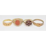 A group of four hallmarked 9ct gold rings comprising one set with goldstone, a garnet cluster, a