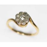 An early 20th century diamond cluster ring, the head measuring approx. 8.04mm in diameter, yellow