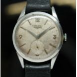 A 1956 Longines stainless steel wristwatch, ref. 6666-4, cal. 12.68Z, silvered dial with outer