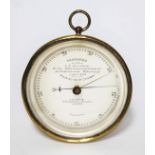 A ship's presentation gilt brass barometer, the dial inscribed 'Presented to J.E. Kershaw by the