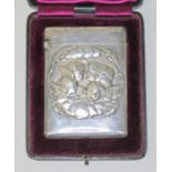 A late Victorian silver card case embossed with cherubs, William Comyns & Sons, London 1897, 7cm x