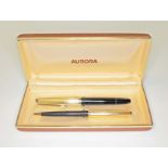 A cased Aurora fountain pen and ball point set.